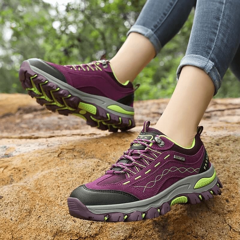 Trekking women's sneakers with lace-up, perfect for hiking; shows deep purple color, rubber outsole for grip, and cotton fabric upper.